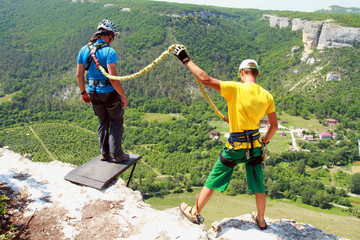 Jump off a cliff with a rope.