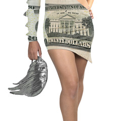 Futuristic young woman in design dress with a twenty dollar note