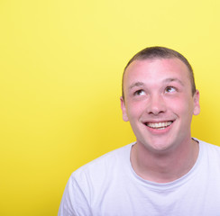 Portrait of happy young man looking up