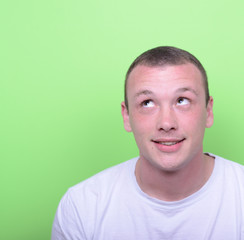 Obraz premium Portrait of happy young man looking up