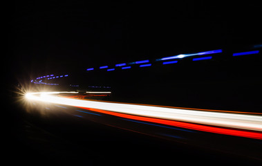 Car light trails in the tunnel.