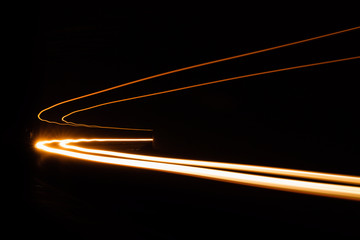 Car light trails in the tunnel.