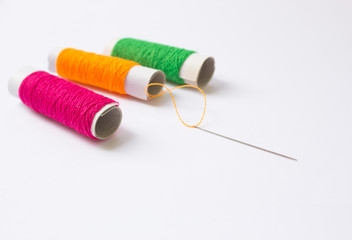 Sewing threads And Needle Background