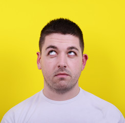 Fototapeta premium Portrait of happy young man looking up