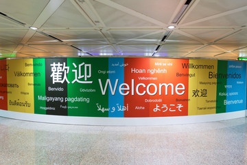 various languages of welcome in a wall