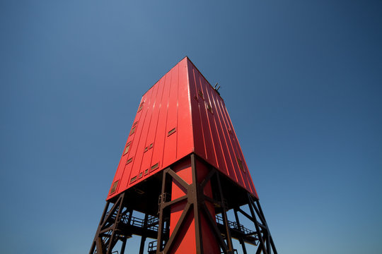 A mine shaft tower at sunset