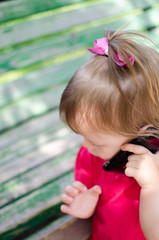 Little girl with mobile phone