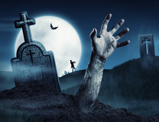 Zombie hand coming out of his grave