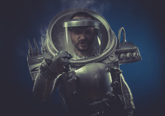 Fototapeta premium Intelligence, robot man in space armor silver