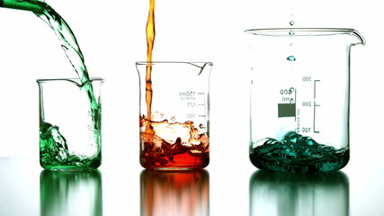 Chemical liquids pouring into beaker - Powered by Adobe