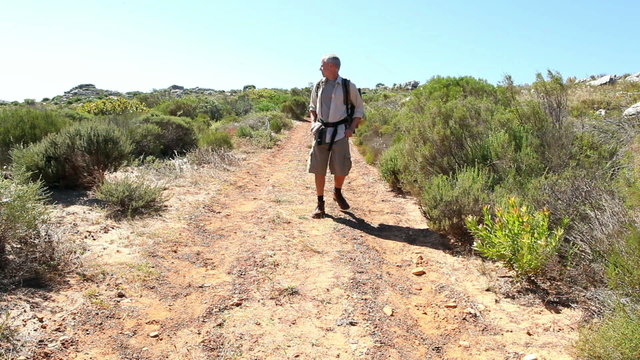Man hiking in nature on wild trail