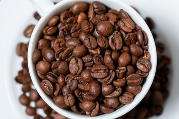 Coffee beans and coffee cup. Close-up.