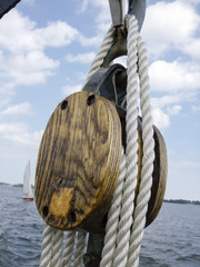 Close-up of a rope tied up with a pulley of boat