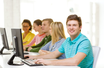 Fototapeta na wymiar male student with classmates in computer class