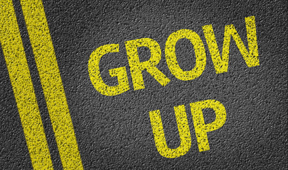Grow Up written on the road