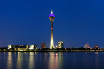 Obraz premium Evening view on the Rheinturm TV tower in Dusseldorf, Germany