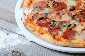 The Italian pizza with olives and a salami