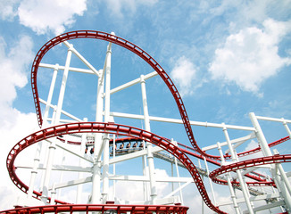 Roller of coaster against blue sky.