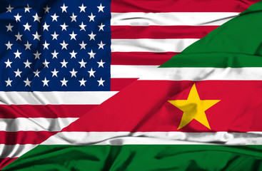 Waving flag of Suriname and USA