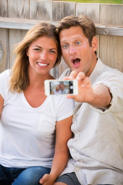 Couple taking selfie with phone
