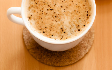 Beverage. Cup of hot drink coffee with froth.