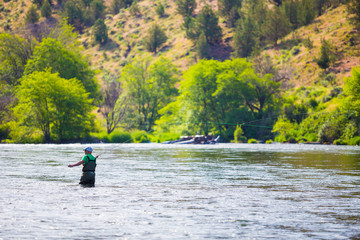 Fototapeta na wymiar Fly Fisherman Casting on the Deschutes River