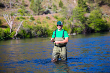 Fly Fisherman Casting on the Deschutes River