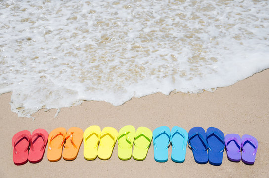 Color flip flops by the ocean