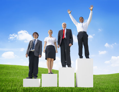 Business People Outdoors Standing on a Bar Graph