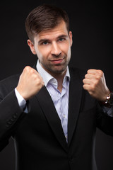 Young businessman in a black suit