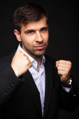 Young businessman in a black suit