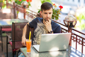 Young businessman with a laptop
