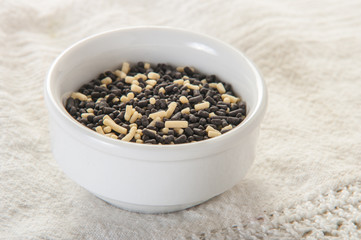 Chocolate sprinkles on white background close up