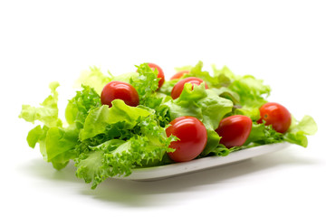 Red tomatoes and green lettuce.