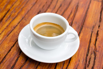 Shot of espresso on table.