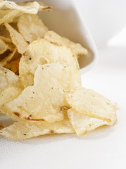 Potato chips bowl isolated on white
