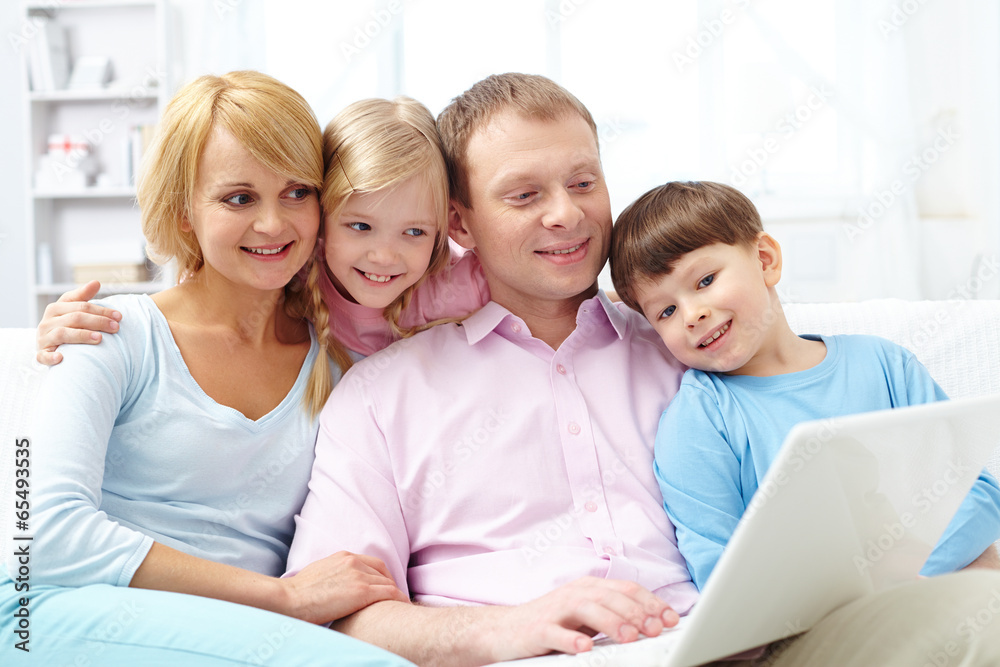 Wall mural family with laptop