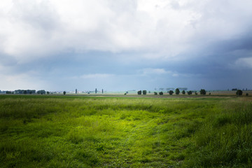 Fototapeta na wymiar Landscape with village before the rain