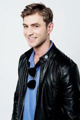 Smiling man with jacket isolated on white