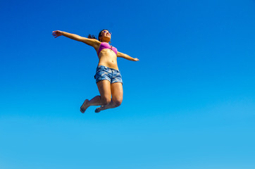 Girl is jumping in the air