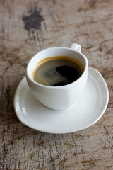 Cup of coffee on a wooden table