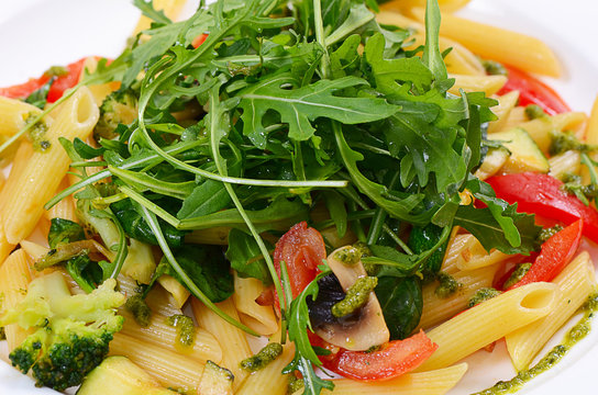 pasta with vegetables and salad