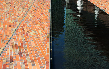 Cobbles and surface water in sunlight