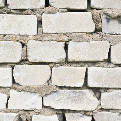Old white brick wall fragment