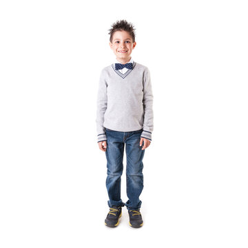 Full body portrait of eight year kid wearing papillon against wh
