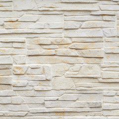 Wall of carved limestone bricks