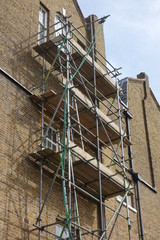 Scaffolding on Tall Brick Building