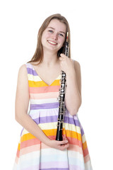 smiling girl in colorful dress with oboe