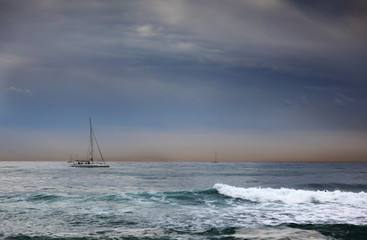 yacht in the sea against the evening sky