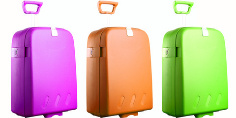three colored suitcases isolated on white